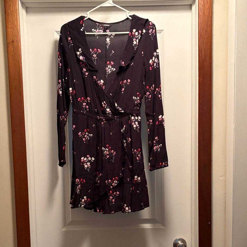 Black and floral dress. Overlaps in front for deep V neckline. Flowy skirt style